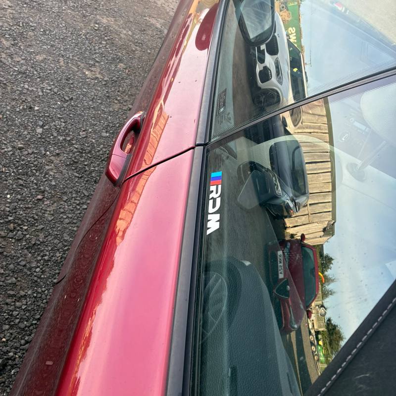 RDM window sticker on a red BMW, seen from above