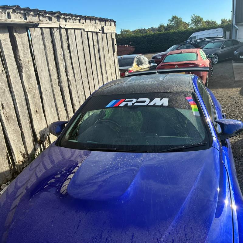 RDM sun strip across the top of a blue M4's windscreen