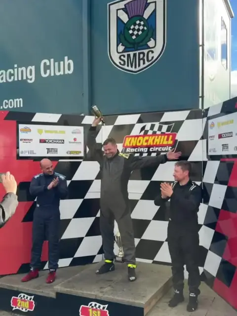 Trophy raised on the podium at Knockhill