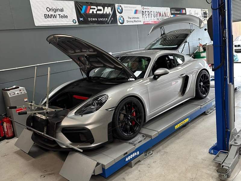 Porsche Cayman GT4 on the alignment ramp